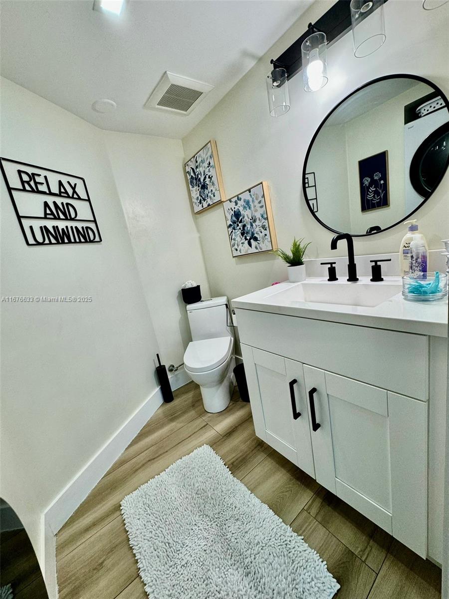 2415 Northwest 16th St Road, Unit 101 Miami, FL 33125 - Photo 19 of 45 Half bathroom 1st floor