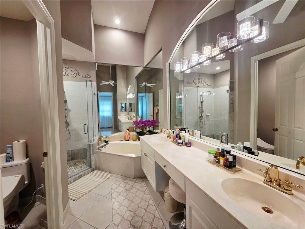 6775 Huntington Lakes Circle, Unit 202 Naples, FL 34119 - Photo 11 of 46 a bathroom with a sink double vanity and a mirror
