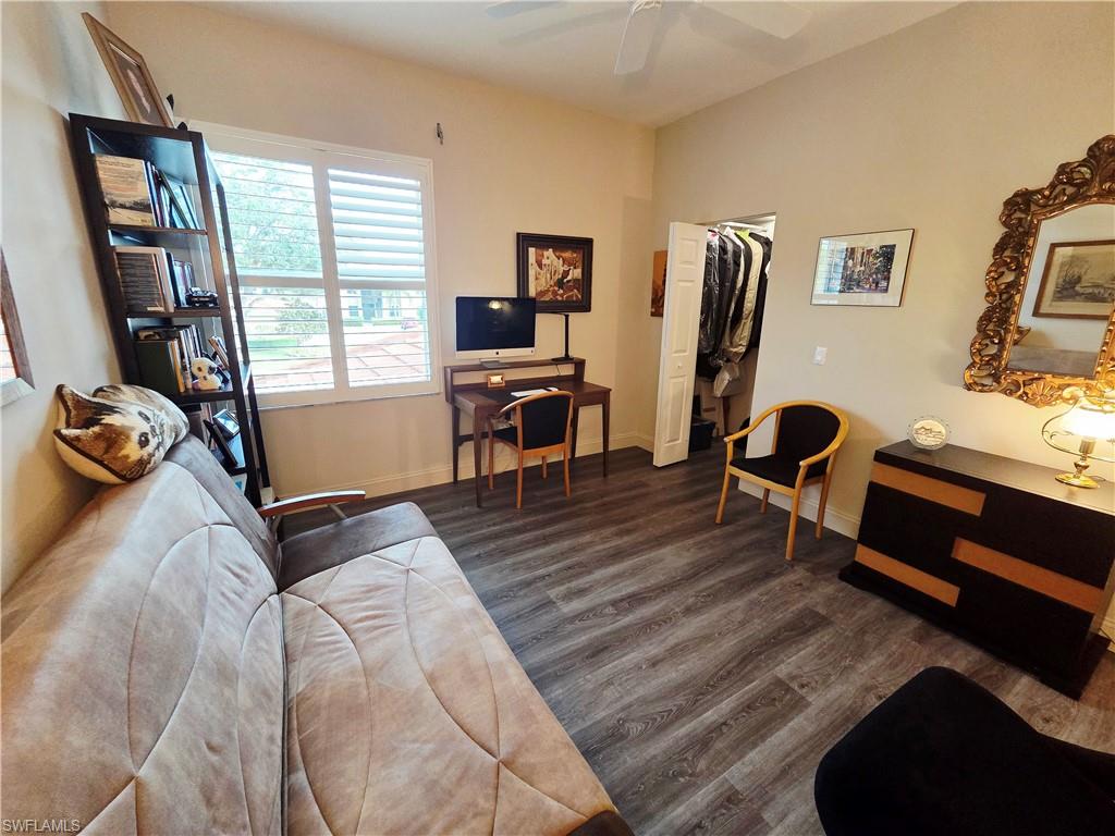 6775 Huntington Lakes Circle, Unit 202 Naples, FL 34119 - Photo 28 of 46 a bedroom with furniture and a window