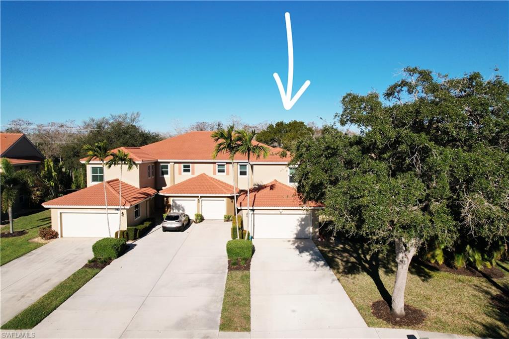 6775 Huntington Lakes Circle, Unit 202 Naples, FL 34119 - Photo 45 of 46 a view of multiple houses with a street