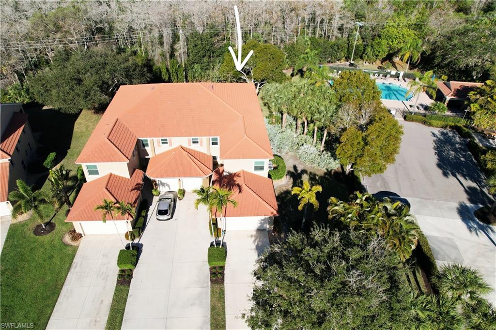 6775 Huntington Lakes Circle, Unit 202 Naples, FL 34119 - Photo 46 of 46 an aerial view of residential house with outdoor space and swimming pool