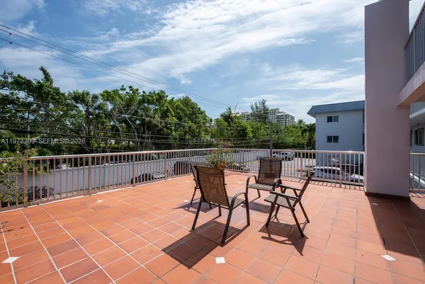 a view of a terrace with furniture