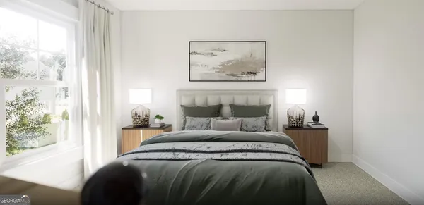 a bedroom with a bed and a painting on the wall