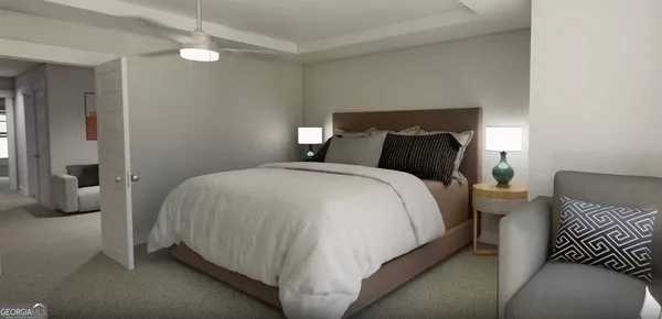 a bedroom with a bed and a lamp