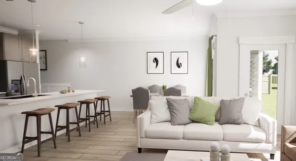 a living room with furniture and wooden floor