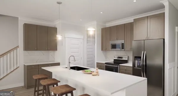 a kitchen with stainless steel appliances kitchen island a refrigerator sink and stove