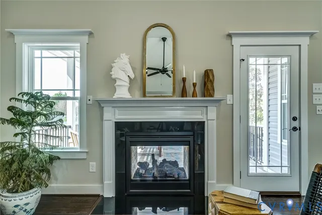 a kitchen with stainless steel appliances granite countertop a dining table chairs refrigerator and sink