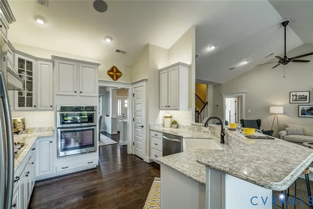 a kitchen with a refrigerator stove and sink