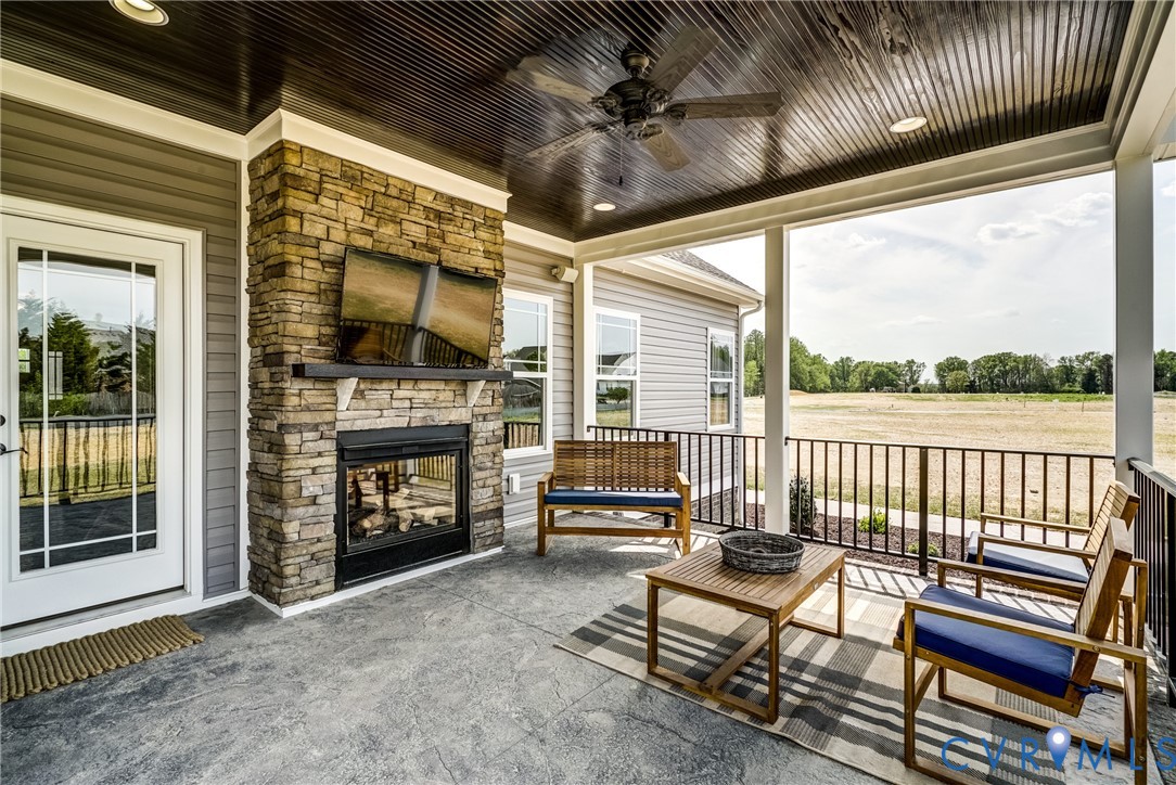 Lot 4 Wendenburg Terrace Aylett, VA 23009 - Photo 31 of 32 a view of a porch with furniture and a fireplace