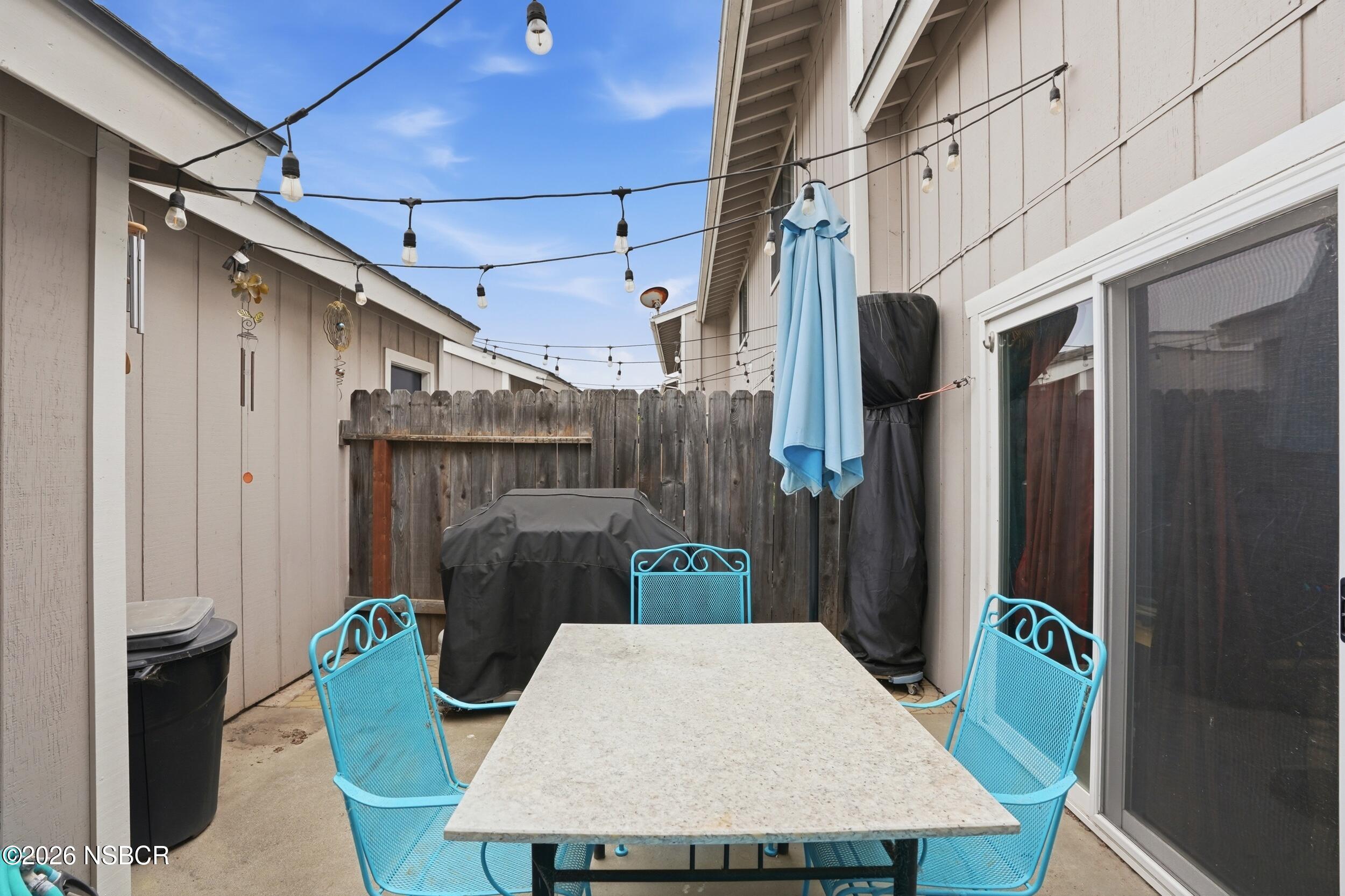 218 North R Street Lompoc, CA 93436 - Photo 22 of 24 a table and chairs in the balcony