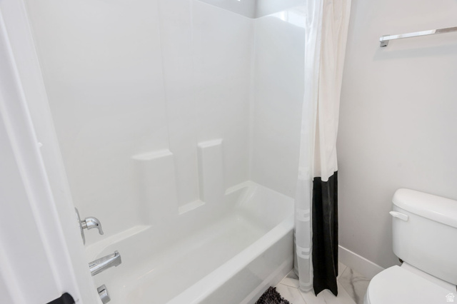 252 North Sunrise Rnch Drive Mapleton, UT 84664 - Photo 28 of 62 Bathtub with an integrated shower surround, chrome fixtures, and a white toilet