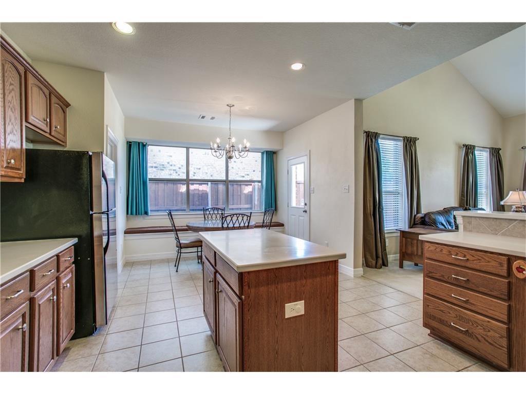 5720 Pebble Ridge Drive McKinney, TX 75070 - Photo 5 of 24 Kitchen open to breakfast and family room.