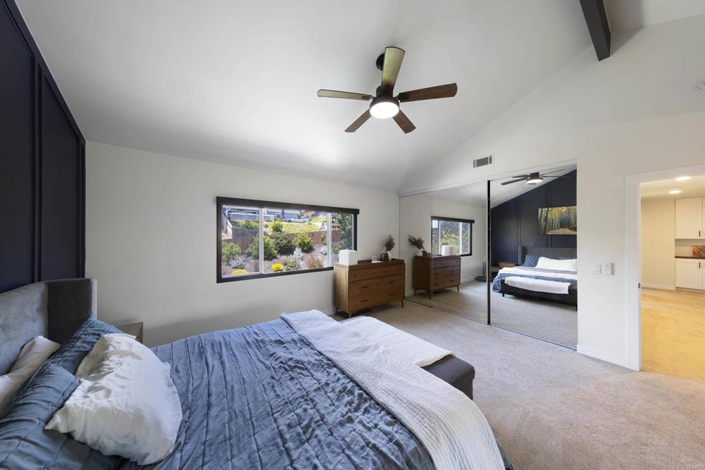 3577 Winslow Road Oceanside, CA 92056 - Photo 26 of 53 a bedroom with a bed and a chandelier
