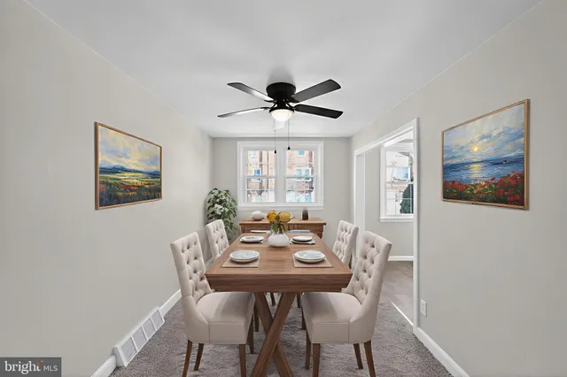 a view of a dining room with furniture and window