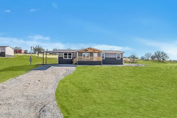 a view of a house with a big yard