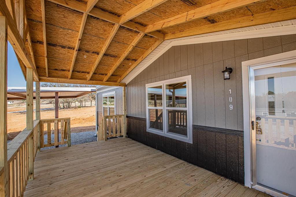 109 Draven Drive Springtown, TX 76082 - Photo 3 of 35 a view of empty room with wooden floor and fan
