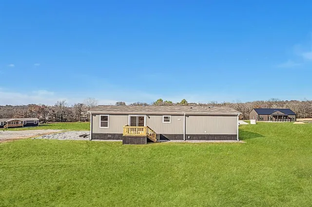 a view of a house with a big yard