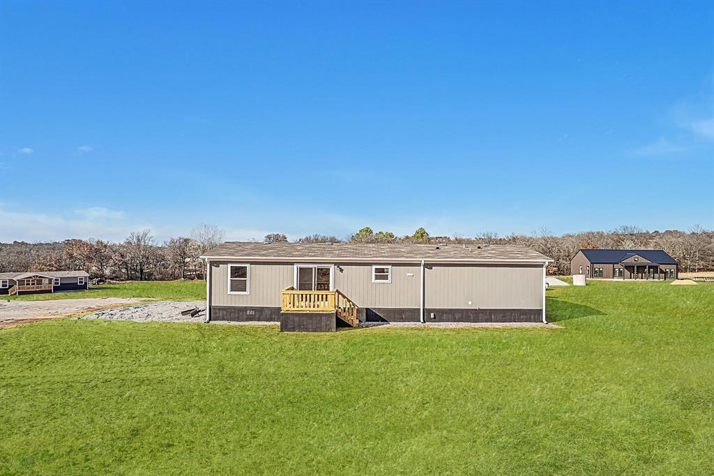 109 Draven Drive Springtown, TX 76082 - Photo 34 of 35 a view of a house with a big yard
