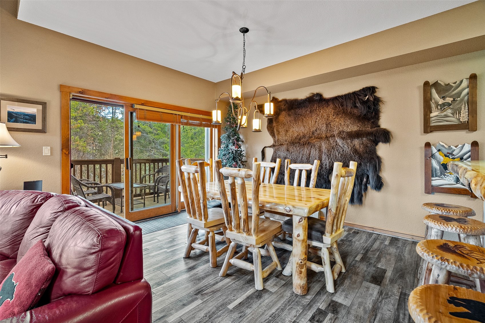 57 Lake Ridge Circle, Unit 1848 Keystone, CO 80435 - Photo 8 of 49 a dining room with furniture a chandelier and wooden floor