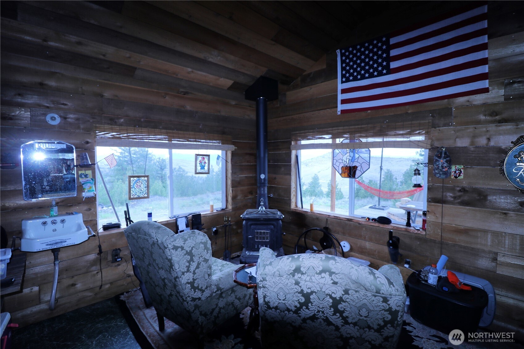 333 Patterson Creek Road Tonasket, WA 98855 - Photo 20 of 30 a living room with furniture and a fireplace