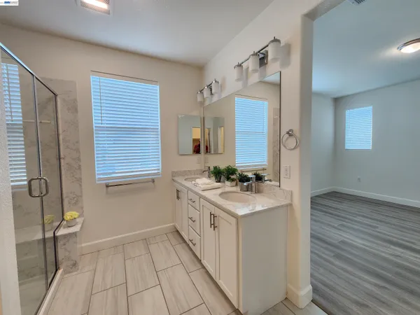 a view of bathroom with dual sinks
