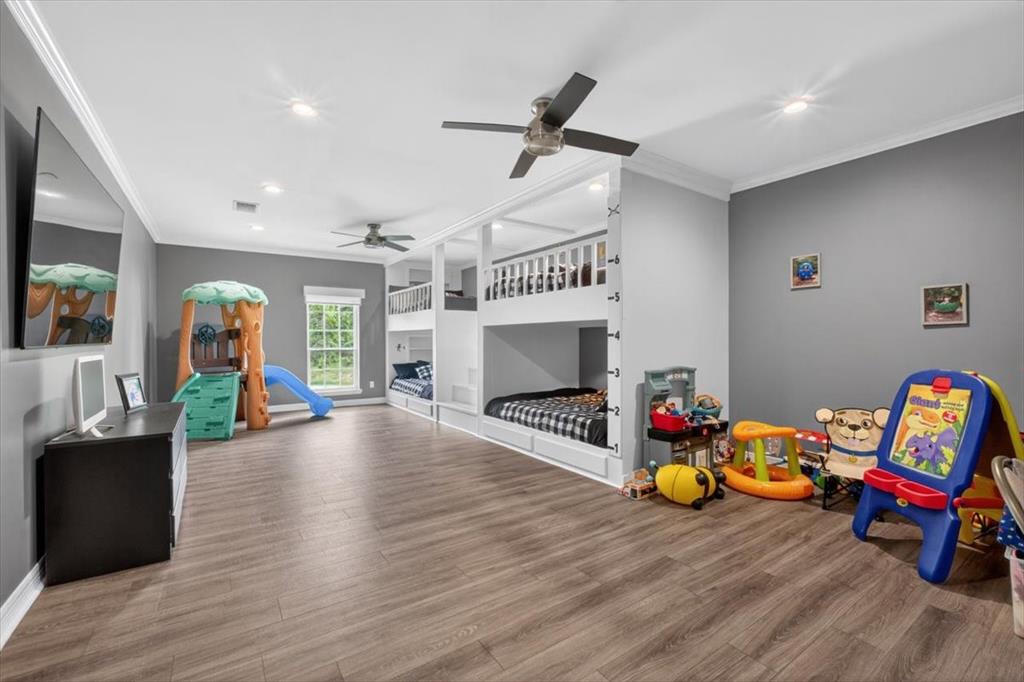 145 Private Road Pittsburg, TX 75686 - Photo 21 of 40 6th Bedroom Bunks with 4 Builtin Queen Beds, Play Area, and 90' TV
