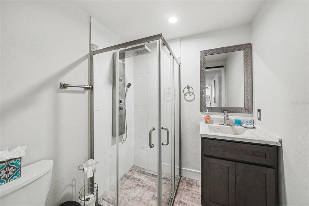 8828 Carmen Lane Port Richey, FL 34668 - Photo 20 of 28 a bathroom with a sink toilet and shower