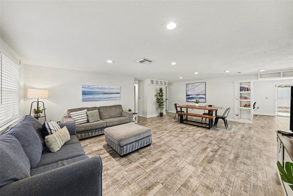 8828 Carmen Lane Port Richey, FL 34668 - Photo 4 of 28 a living room with furniture and a table