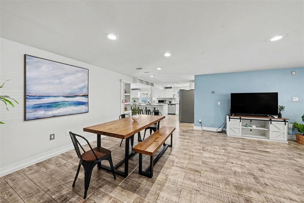 8828 Carmen Lane Port Richey, FL 34668 - Photo 9 of 28 a living room with furniture and a flat screen tv