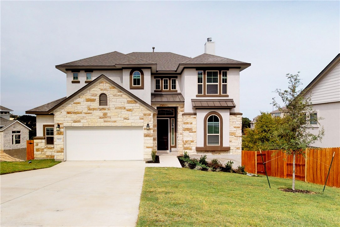 5520 Limestone Spring Cove Austin, TX 78738 - Photo 1 of 1 a front view of a house with a yard