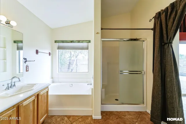 a bathroom with a shower sink and mirror