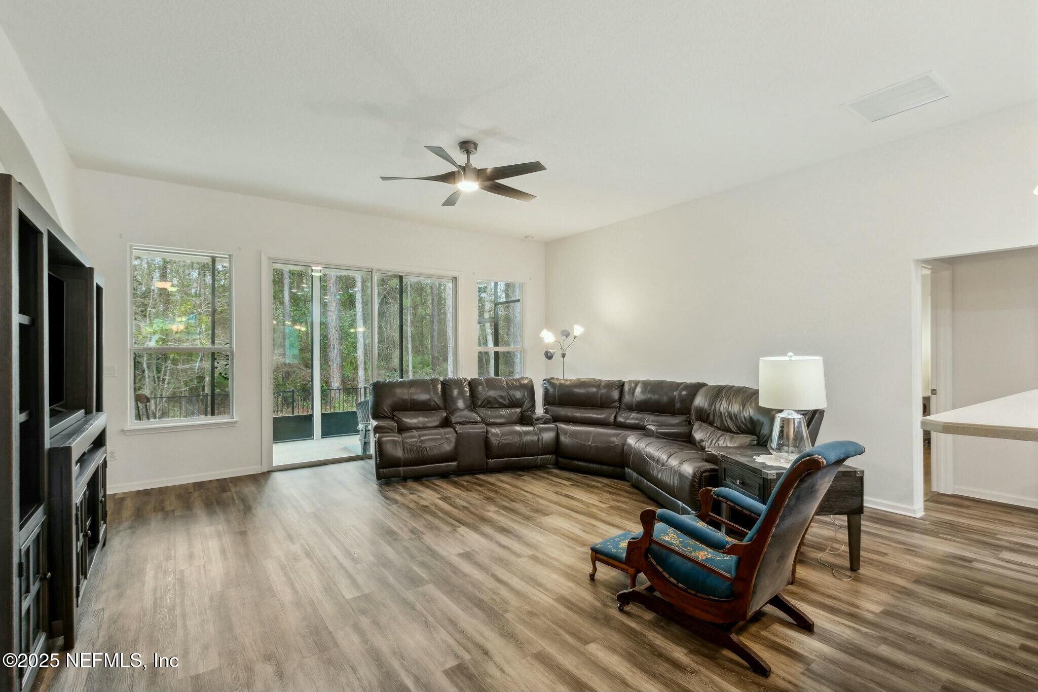 86197 Fortune Drive Yulee, FL 32097 - Photo 12 of 36 a living room with furniture and a flat screen tv