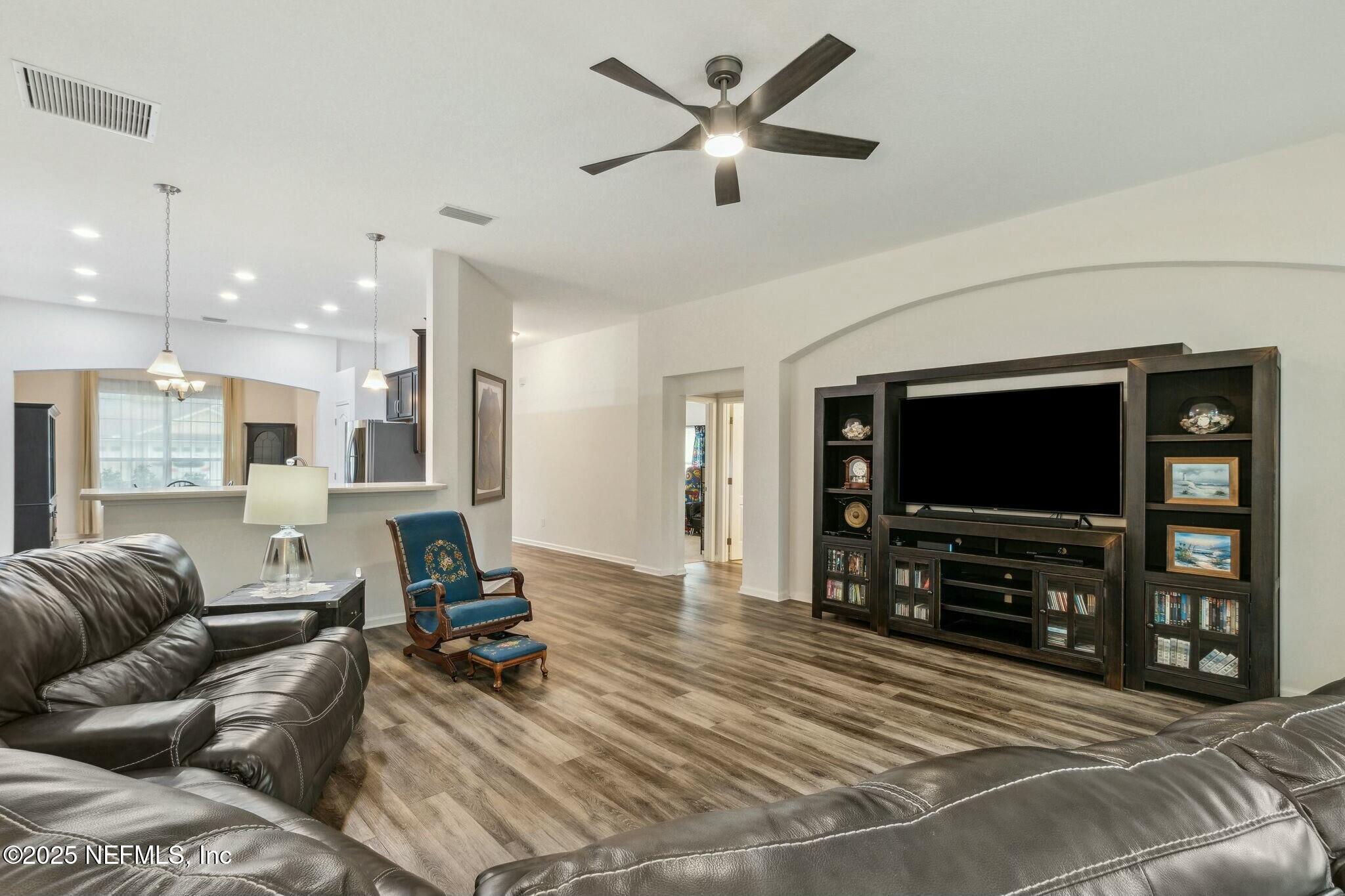 86197 Fortune Drive Yulee, FL 32097 - Photo 14 of 36 a living room with furniture and a flat screen tv