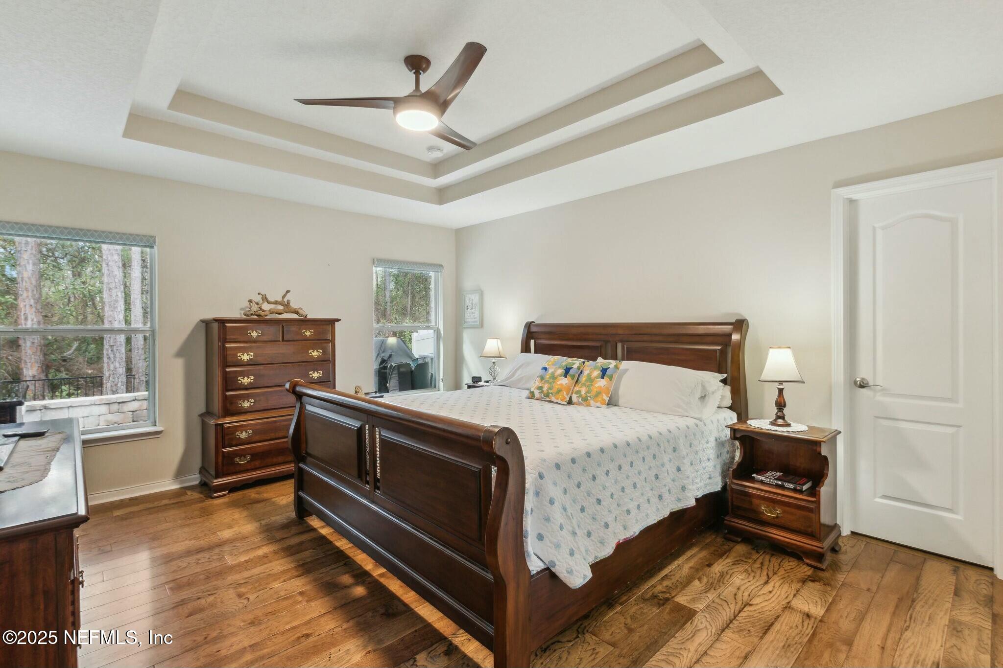 86197 Fortune Drive Yulee, FL 32097 - Photo 15 of 36 a bedroom with a bed and wooden floor