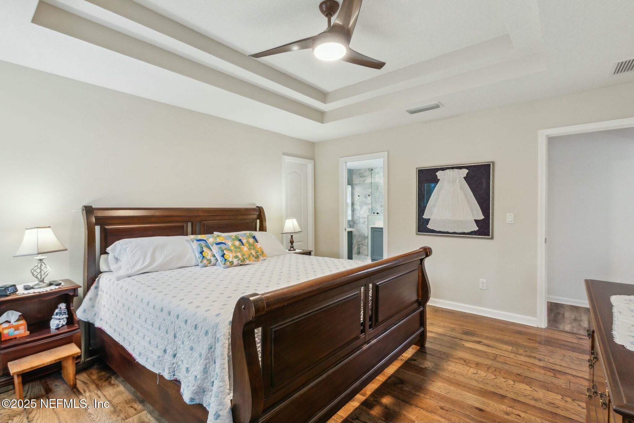 86197 Fortune Drive Yulee, FL 32097 - Photo 16 of 36 a bedroom with a bed and a dresser