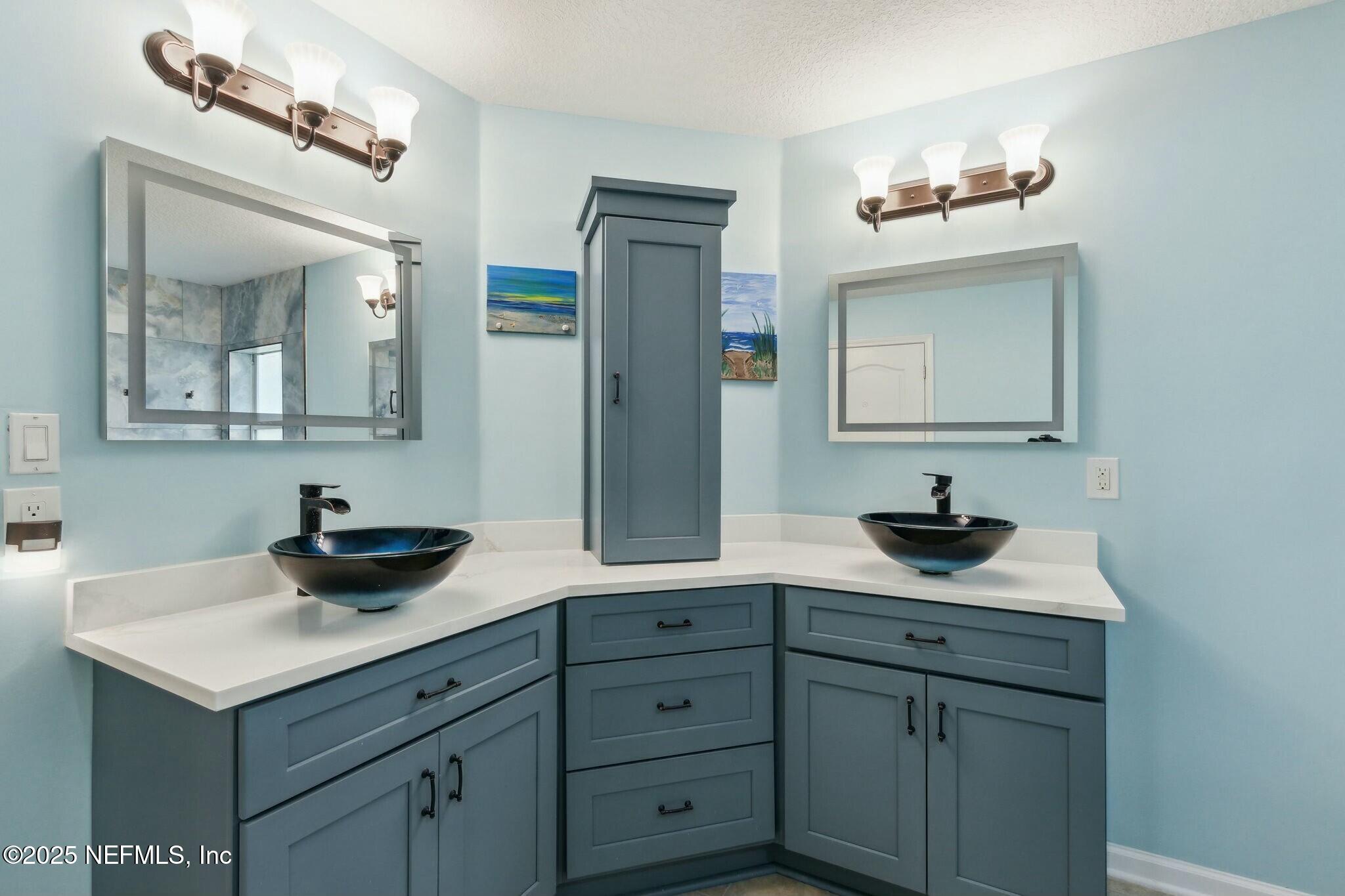 86197 Fortune Drive Yulee, FL 32097 - Photo 18 of 36 a bathroom with a sink and a mirror