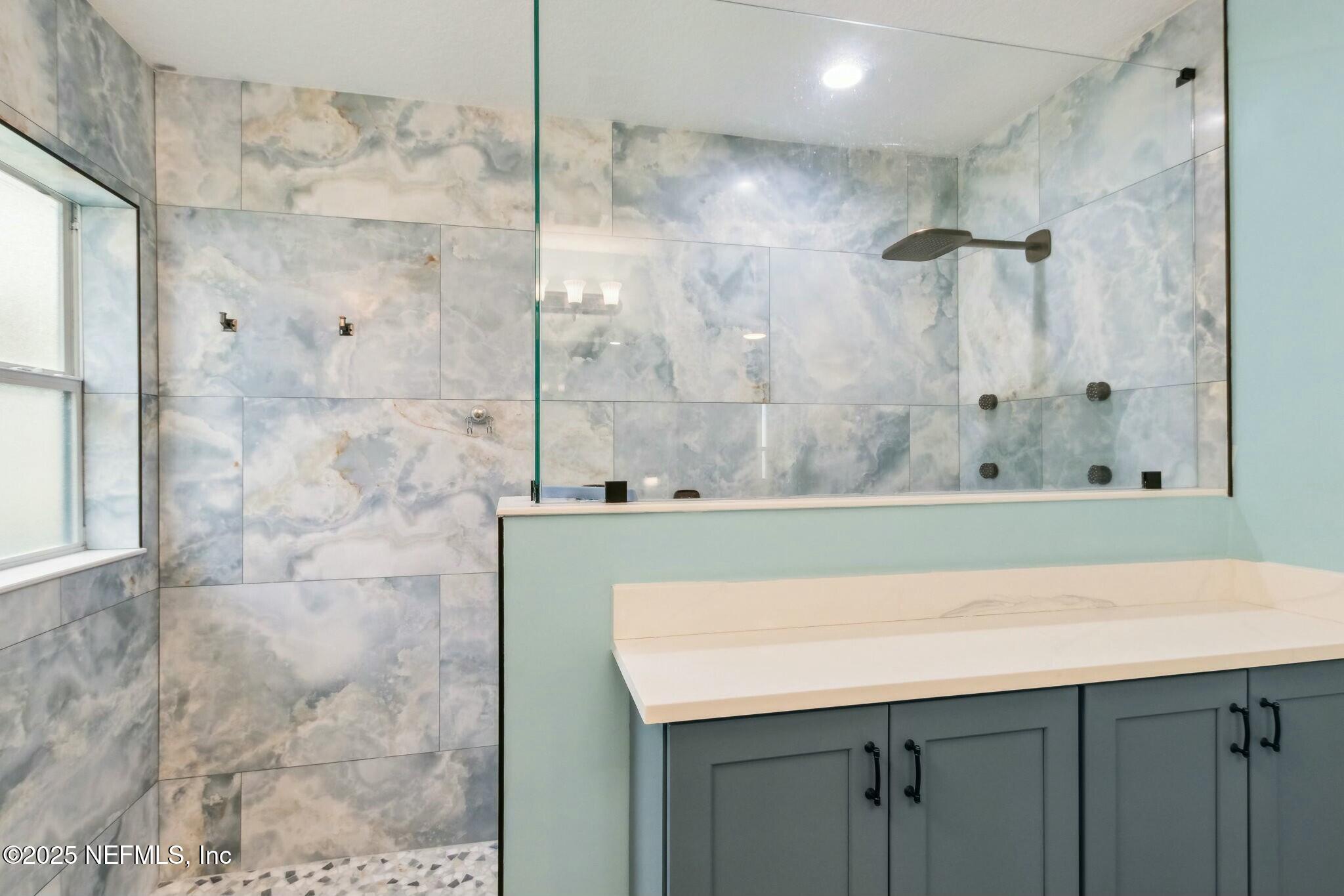 86197 Fortune Drive Yulee, FL 32097 - Photo 19 of 36 a bathroom with a sink and a mirror