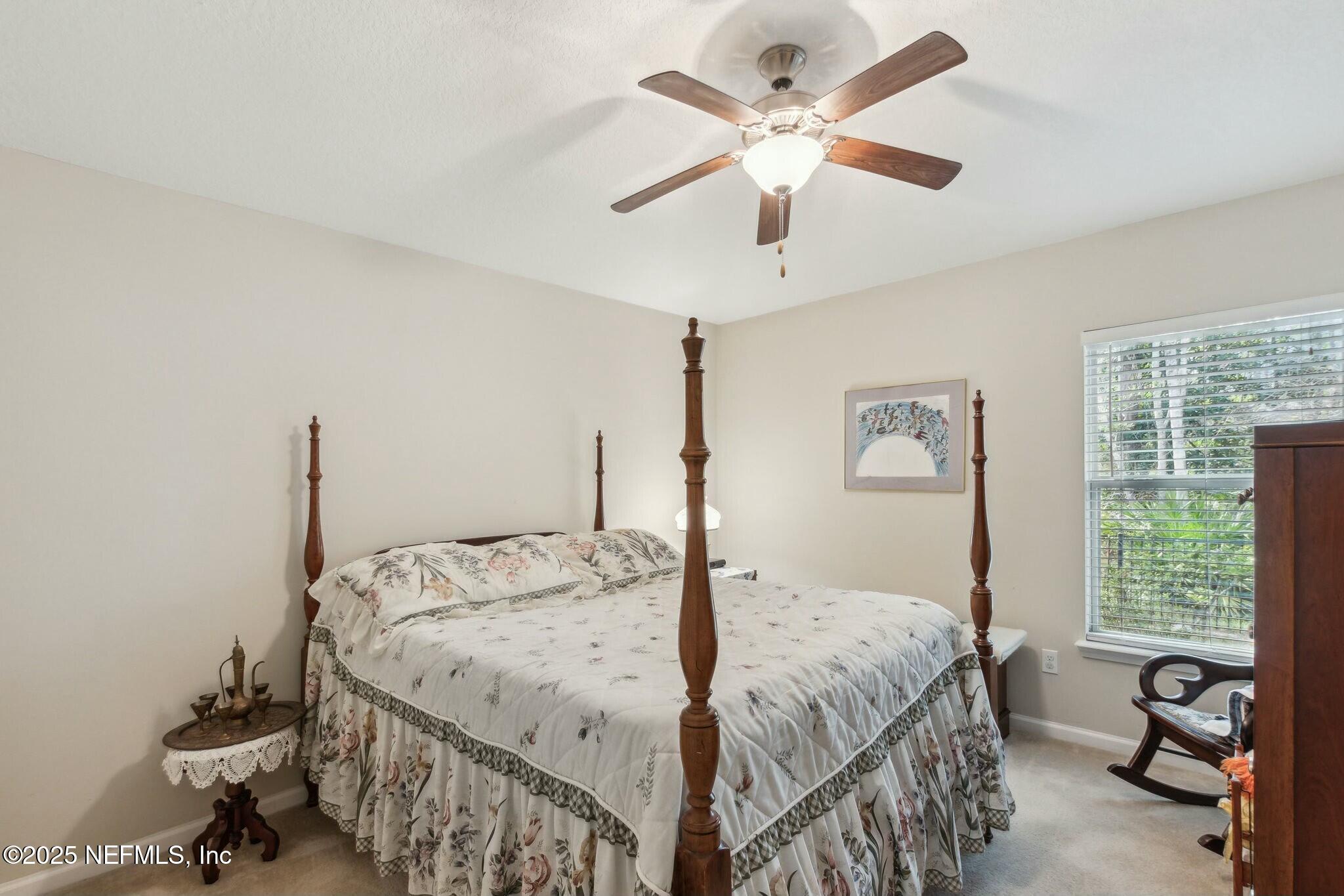 86197 Fortune Drive Yulee, FL 32097 - Photo 20 of 36 a bed sitting in a bedroom next to a window