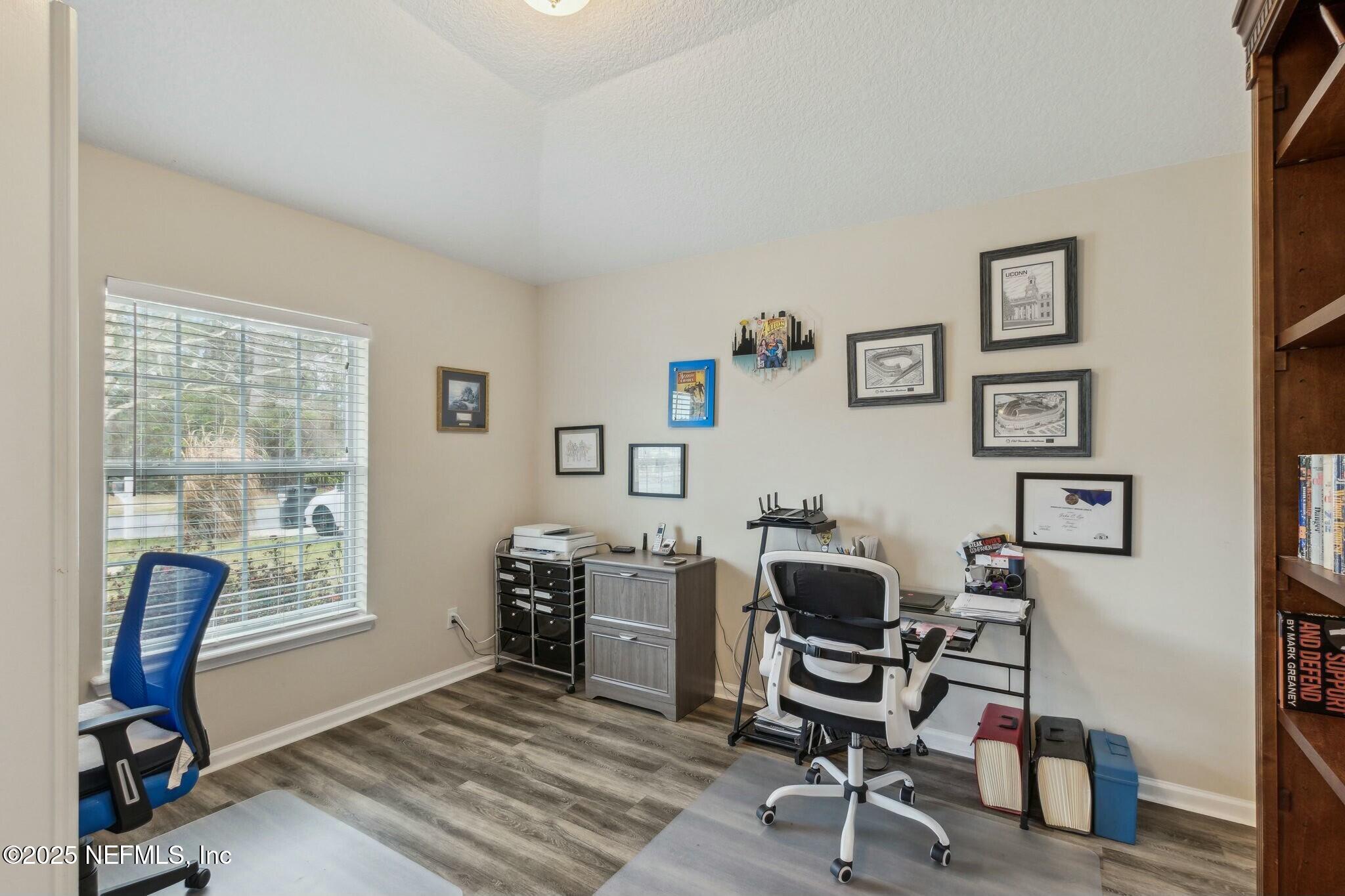 86197 Fortune Drive Yulee, FL 32097 - Photo 23 of 36 a view of a workspace with furniture and a window