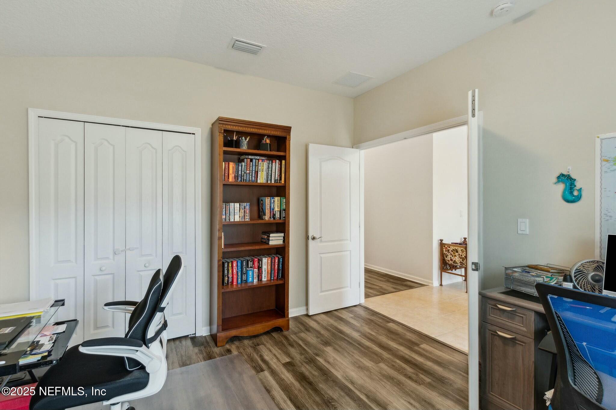 86197 Fortune Drive Yulee, FL 32097 - Photo 24 of 36 a view of a workspace with furniture and wooden floor