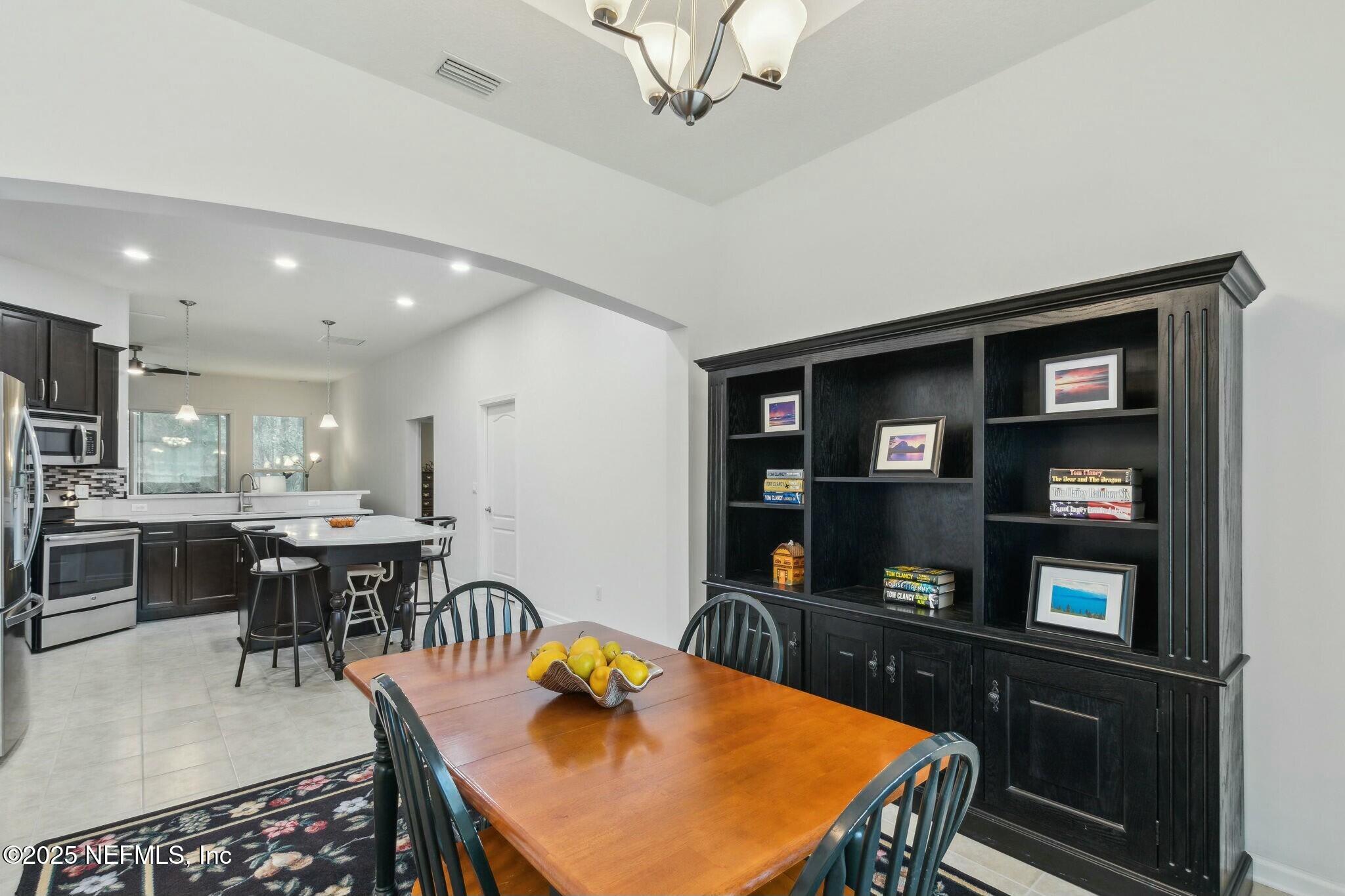 86197 Fortune Drive Yulee, FL 32097 - Photo 4 of 36 a view of a dining room with furniture