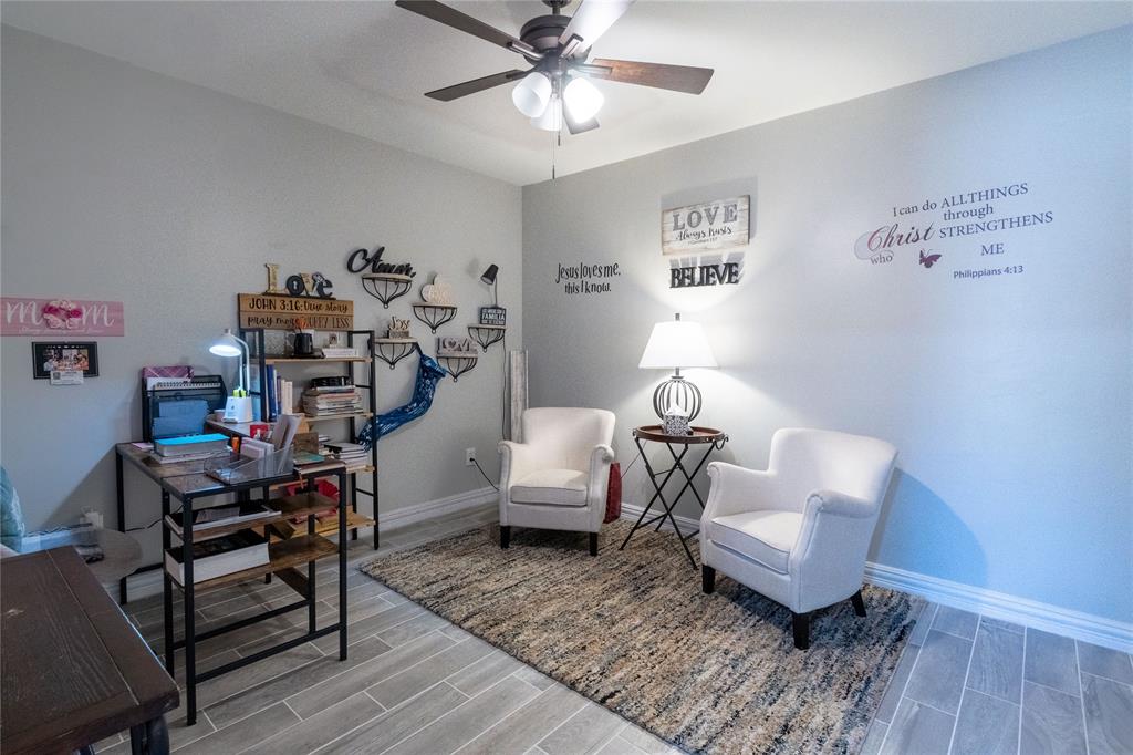 1246 Meadow Way Terrell, TX 75160 - Photo 11 of 39 a living room with furniture and a wooden floor