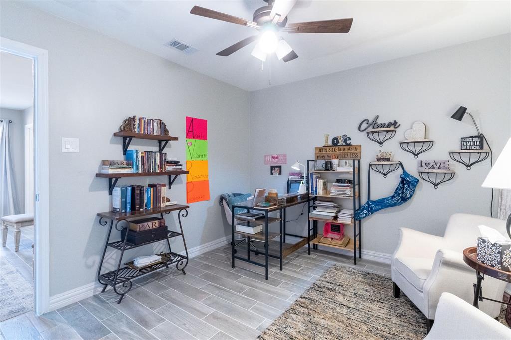 1246 Meadow Way Terrell, TX 75160 - Photo 14 of 39 a workspace room with furniture and wooden floor