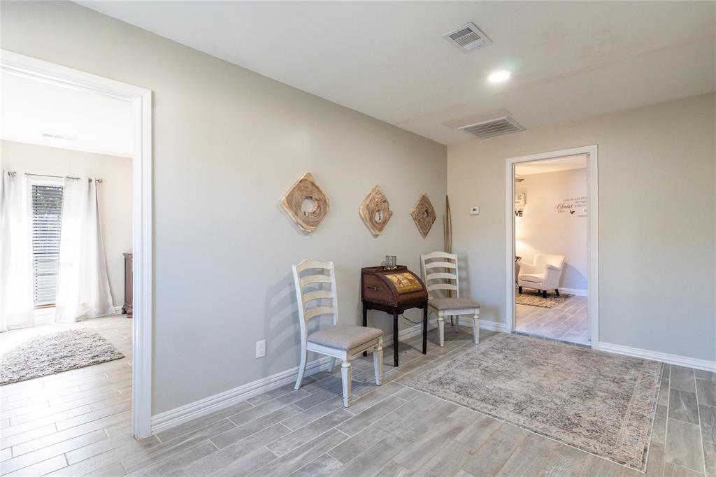1246 Meadow Way Terrell, TX 75160 - Photo 15 of 39 a living room with furniture and a wooden floor