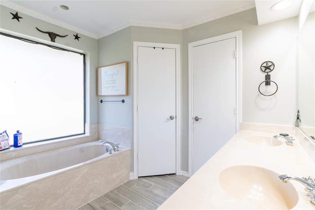 1246 Meadow Way Terrell, TX 75160 - Photo 24 of 39 a bathroom with a tub shower and sink