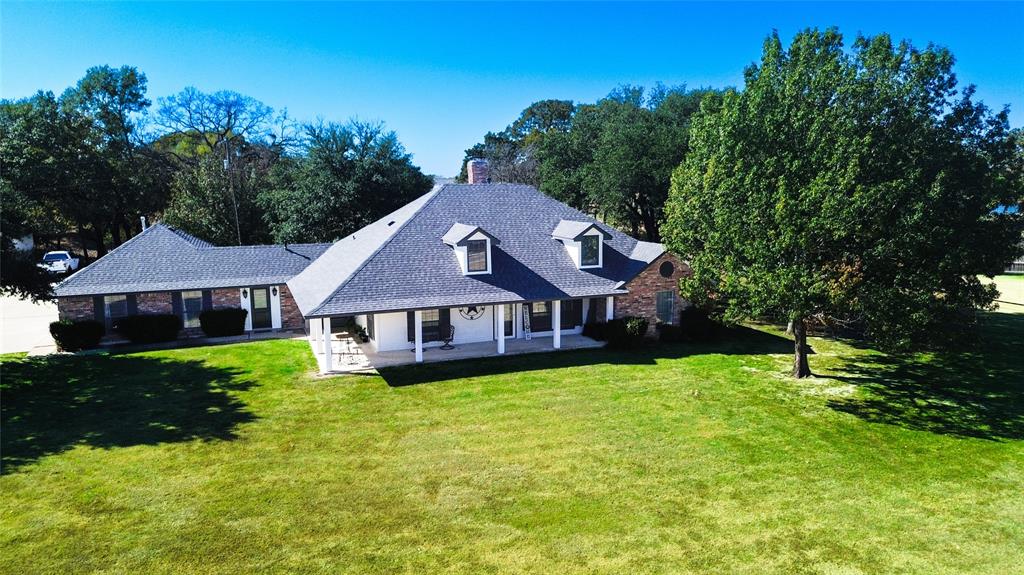1246 Meadow Way Terrell, TX 75160 - Photo 25 of 39 a front view of a house with garden