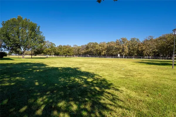 a view of a lake with a yard