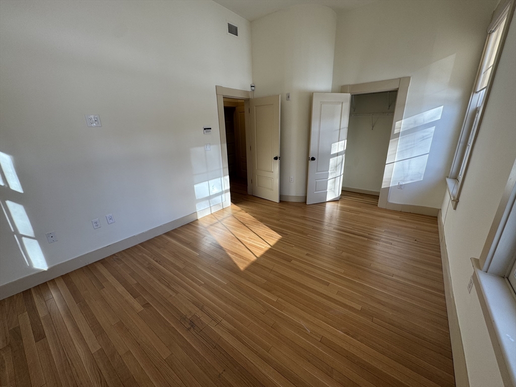 10 Linwood Street, Unit 3 Boston, MA 02119 - Photo 11 of 16 a view of a hallway with wooden floor