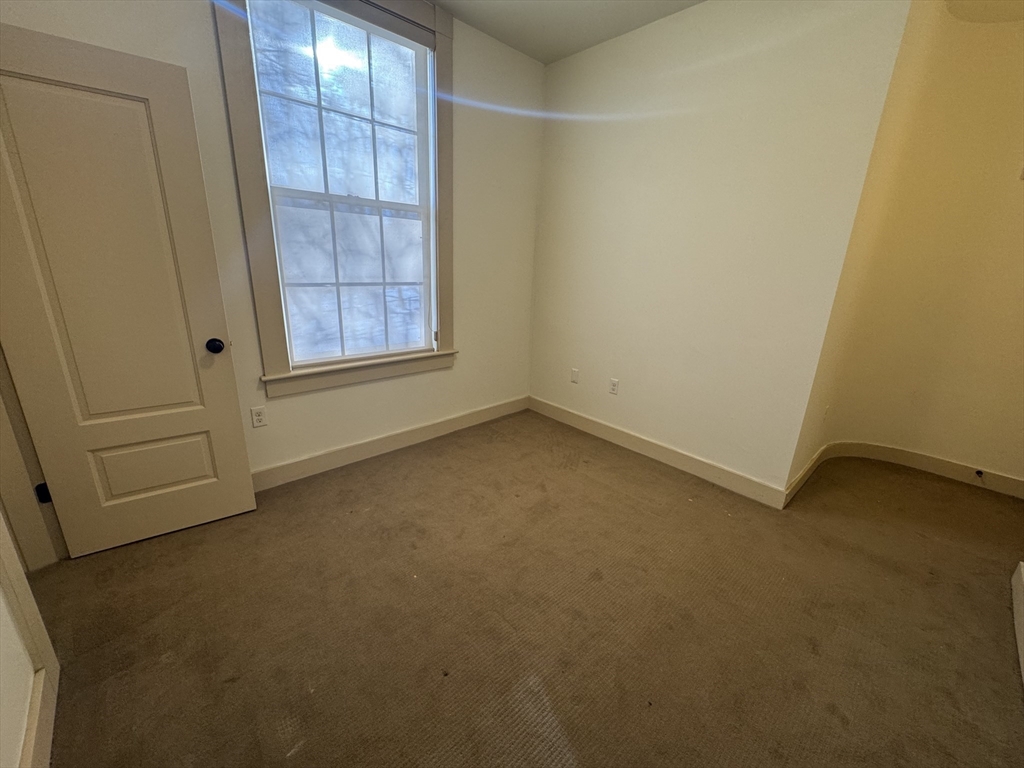 10 Linwood Street, Unit 3 Boston, MA 02119 - Photo 16 of 16 an empty room with windows