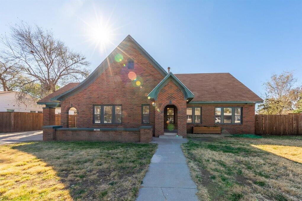 2215 18th Street, Unit FRONT Lubbock, TX 79401 - Photo 19 of 19 a front view of a house with a yard and garage